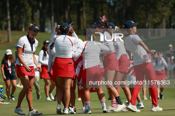 GAINESVILLE, VIRGINIA - SEPTEMBER 15: Team USA players celebrate after winning the Solheim Cup at Robert Trent Jones Golf Club on Sunday, Se...