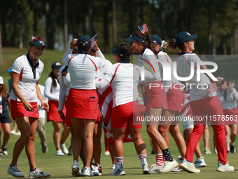 GAINESVILLE, VIRGINIA - SEPTEMBER 15: Team USA players celebrate after winning the Solheim Cup at Robert Trent Jones Golf Club on Sunday, Se...