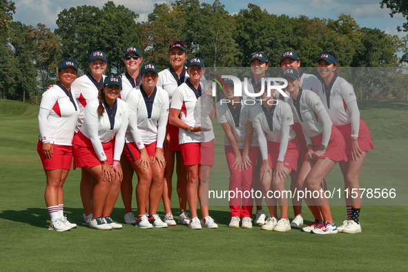 GAINESVILLE, VIRGINIA - SEPTEMBER 15: Team USA poses with the trophy on the 18th green at the conclusion  of the Solheim Cup at Robert Trent...