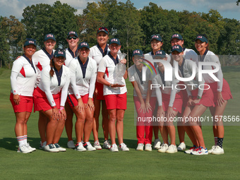 GAINESVILLE, VIRGINIA - SEPTEMBER 15: Team USA poses with the trophy on the 18th green at the conclusion  of the Solheim Cup at Robert Trent...