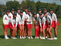 GAINESVILLE, VIRGINIA - SEPTEMBER 15: Team USA poses with the trophy on the 18th green at the conclusion  of the Solheim Cup at Robert Trent...