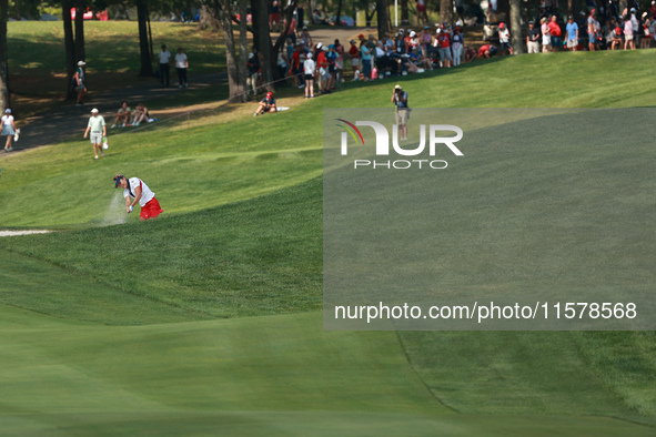 GAINESVILLE, VIRGINIA - SEPTEMBER 15: Lexi Thompson of the United States plays her second shot out of the bunker on the 15th hole during sin...