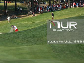 GAINESVILLE, VIRGINIA - SEPTEMBER 15: Lexi Thompson of the United States plays her second shot out of the bunker on the 15th hole during sin...