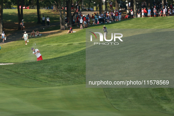 GAINESVILLE, VIRGINIA - SEPTEMBER 15: Lexi Thompson of the United States plays her second shot out of the bunker on the 15th hole during sin...