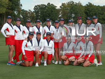 GAINESVILLE, VIRGINIA - SEPTEMBER 15: Team USA poses with the trophy on the 18th green at the conclusion  of the Solheim Cup at Robert Trent...