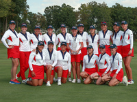 GAINESVILLE, VIRGINIA - SEPTEMBER 15: Team USA poses with the trophy on the 18th green at the conclusion  of the Solheim Cup at Robert Trent...