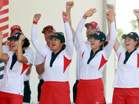 GAINESVILLE, VIRGINIA - SEPTEMBER 15: Some of the members of Team USA cheer during the award ceremony at the conclusion of the Solheim Cup a...