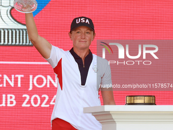 GAINESVILLE, VIRGINIA - SEPTEMBER 15: Captain Stacy Lewis of the United States raises the trophy during the awards ceremony on the Great Law...