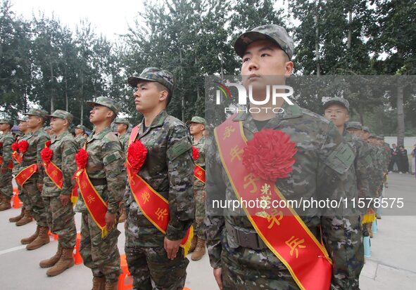 New recruits line up at the militia training base in Yongnian district of Handan, China, on September 14, 2024. 