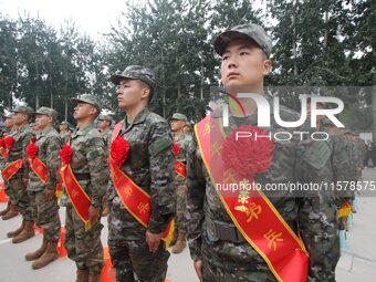 New recruits line up at the militia training base in Yongnian district of Handan, China, on September 14, 2024. (