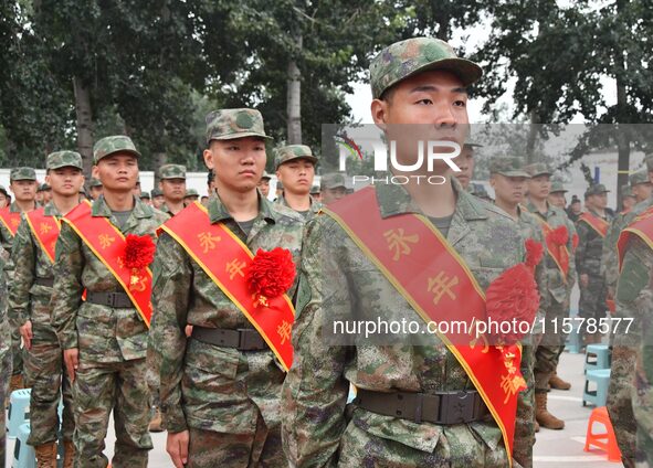 New recruits line up at the militia training base in Yongnian district of Handan, China, on September 14, 2024. 