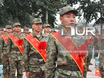 New recruits line up at the militia training base in Yongnian district of Handan, China, on September 14, 2024. (