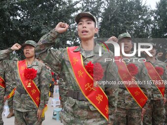 New recruits take a solemn oath at the militia training base in Yongnian district, Handan, China, on September 14, 2024. (