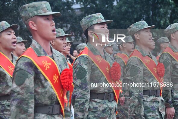 New recruits sing the national anthem at the militia training base in Yongnian district of Handan, in Handan, China, on September 14, 2024. 