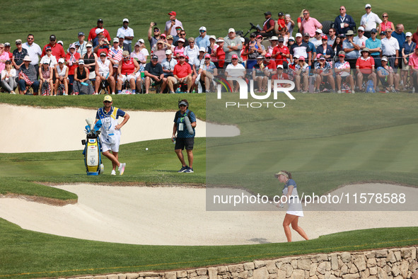 GAINESVILLE, VIRGINIA - SEPTEMBER 15: Georgia Hall of Team Europe hits out of the bunker toward the 14th green during single matches on Day...