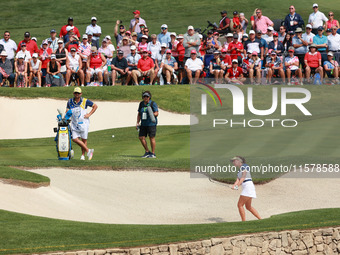 GAINESVILLE, VIRGINIA - SEPTEMBER 15: Georgia Hall of Team Europe hits out of the bunker toward the 14th green during single matches on Day...