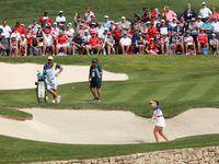 GAINESVILLE, VIRGINIA - SEPTEMBER 15: Georgia Hall of Team Europe hits out of the bunker toward the 14th green during single matches on Day...