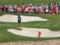 GAINESVILLE, VIRGINIA - SEPTEMBER 15: Alison Lee of the United States hits out of the bunker toward the 14th green during single matches on...