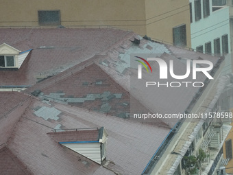 Part of the roof surface is blown by strong winds in Yangpu district, in Shanghai, China, on September 16, 2024. (