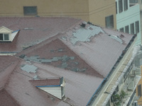 Part of the roof surface is blown by strong winds in Yangpu district, in Shanghai, China, on September 16, 2024. (