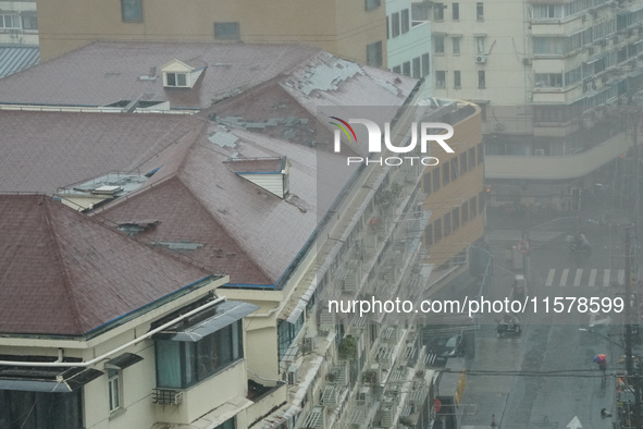 Part of the roof surface is blown by strong winds in Yangpu district, in Shanghai, China, on September 16, 2024. 