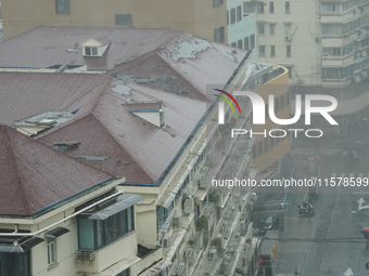 Part of the roof surface is blown by strong winds in Yangpu district, in Shanghai, China, on September 16, 2024. (