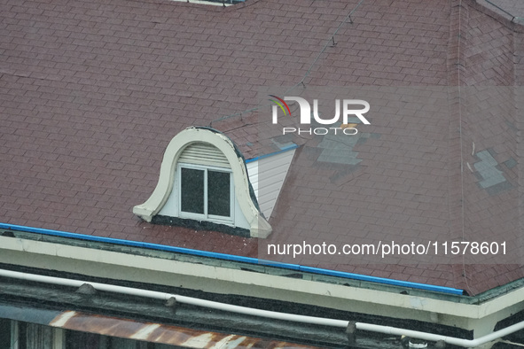 Part of the roof surface is blown by strong winds in Yangpu district, in Shanghai, China, on September 16, 2024. 