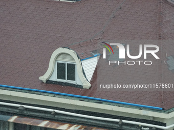 Part of the roof surface is blown by strong winds in Yangpu district, in Shanghai, China, on September 16, 2024. (