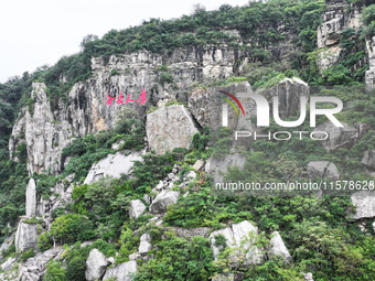 View of the Xiong 'er Mountain Rift Valley in Zaozhuang, China, on September 15, 2024. This geological formation results from a landslide ca...