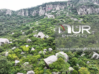 View of the Xiong 'er Mountain Rift Valley in Zaozhuang, China, on September 15, 2024. This geological formation results from a landslide ca...