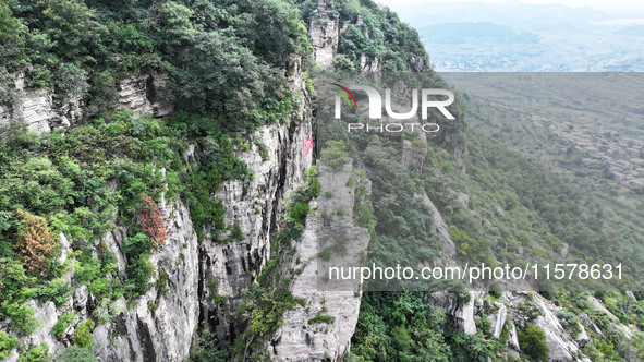 View of the Xiong 'er Mountain Rift Valley in Zaozhuang, China, on September 15, 2024. This geological formation results from a landslide ca...