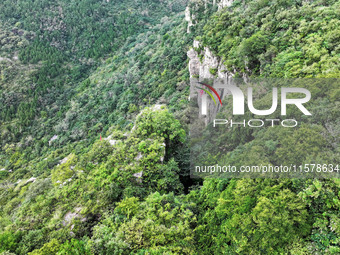 View of the Xiong 'er Mountain Rift Valley in Zaozhuang, China, on September 15, 2024. This geological formation results from a landslide ca...