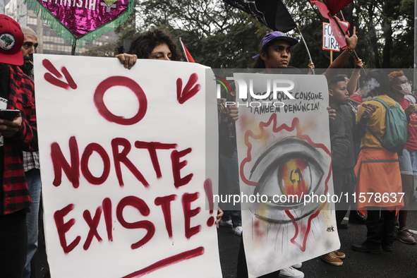 Protesters hold a demonstration against the fires and the climate situation in Brazil and for agrarian reform on Avenida Paulista, in the ce...