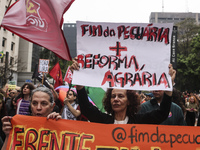 Protesters hold a demonstration against the fires and the climate situation in Brazil and for agrarian reform on Avenida Paulista, in the ce...