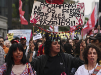 Protesters hold a demonstration against the fires and the climate situation in Brazil and for agrarian reform on Avenida Paulista, in the ce...