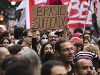 Protesters hold a demonstration against the fires and the climate situation in Brazil and for agrarian reform on Avenida Paulista, in the ce...