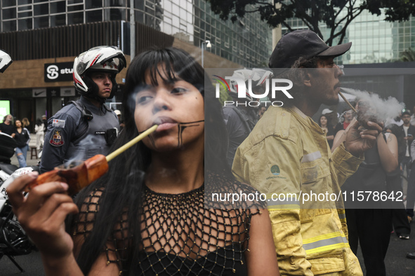 Protesters hold a demonstration against the fires and the climate situation in Brazil and for agrarian reform on Avenida Paulista, in the ce...