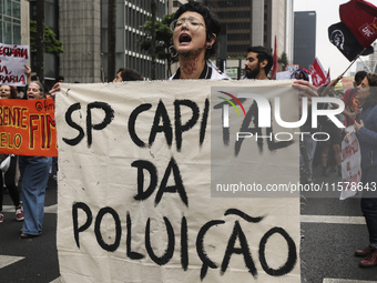 Protesters hold a demonstration against the fires and the climate situation in Brazil and for agrarian reform on Avenida Paulista, in the ce...