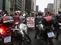 Protesters hold a demonstration against the fires and the climate situation in Brazil and for agrarian reform on Avenida Paulista, in the ce...