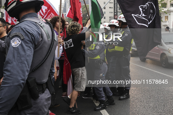 Protesters hold a demonstration against the fires and the climate situation in Brazil and for agrarian reform on Avenida Paulista, in the ce...