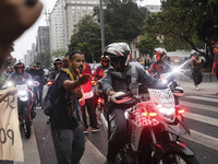 Protesters hold a demonstration against the fires and the climate situation in Brazil and for agrarian reform on Avenida Paulista, in the ce...