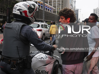 Protesters hold a demonstration against the fires and the climate situation in Brazil and for agrarian reform on Avenida Paulista, in the ce...