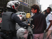 Protesters hold a demonstration against the fires and the climate situation in Brazil and for agrarian reform on Avenida Paulista, in the ce...