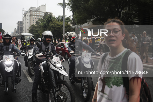 Protesters hold a demonstration against the fires and the climate situation in Brazil and for agrarian reform on Avenida Paulista, in the ce...