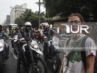 Protesters hold a demonstration against the fires and the climate situation in Brazil and for agrarian reform on Avenida Paulista, in the ce...