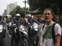 Protesters hold a demonstration against the fires and the climate situation in Brazil and for agrarian reform on Avenida Paulista, in the ce...