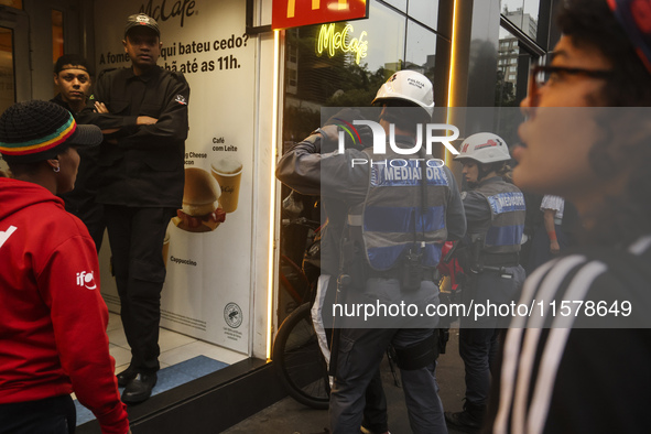 Protesters hold a demonstration against the fires and the climate situation in Brazil and for agrarian reform on Avenida Paulista, in the ce...