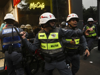 Protesters hold a demonstration against the fires and the climate situation in Brazil and for agrarian reform on Avenida Paulista, in the ce...