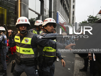 Protesters hold a demonstration against the fires and the climate situation in Brazil and for agrarian reform on Avenida Paulista, in the ce...