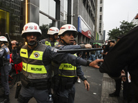 Protesters hold a demonstration against the fires and the climate situation in Brazil and for agrarian reform on Avenida Paulista, in the ce...